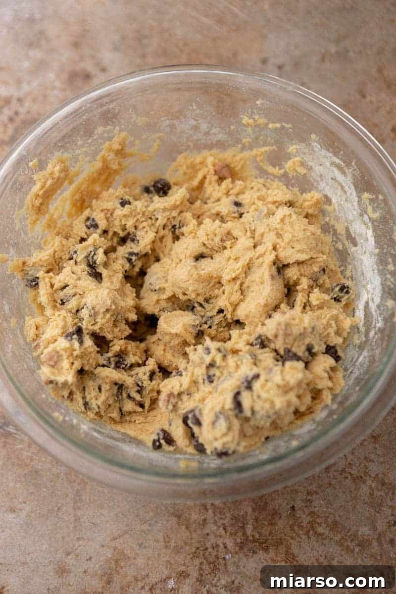 Gooey Skillet Chocolate Chip Pizookie 6 Chocolate chip cookie dough in a bowl after all ingredients have been mixed, ready to be transferred to a skillet.