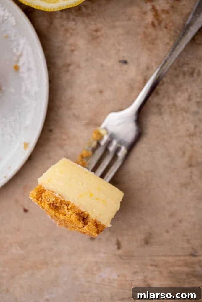 Close-up of a lemon bar piece on a fork