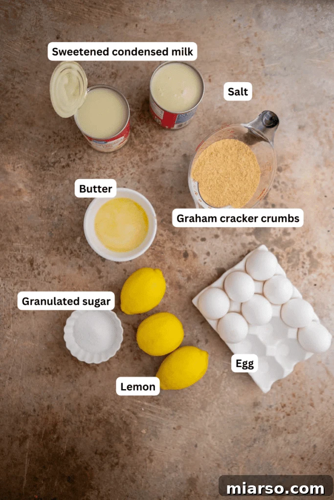 Simple ingredients for homemade lemon bars laid out on a kitchen counter