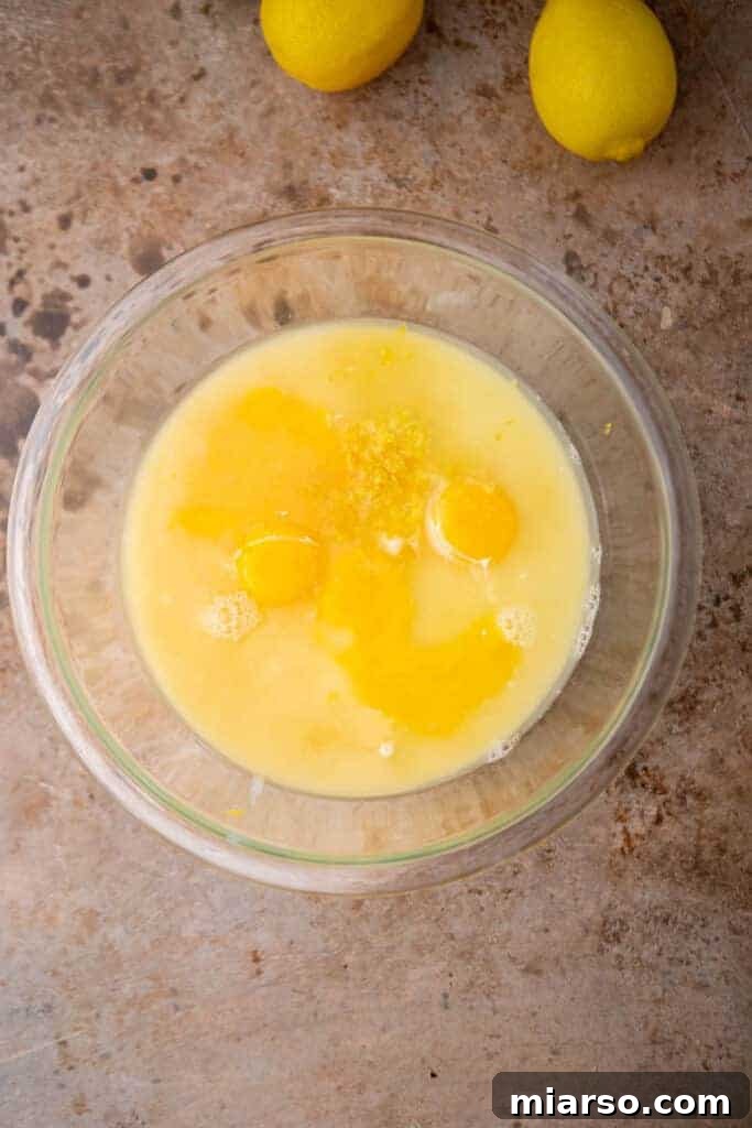 Wet ingredients for lemon bar filling in a bowl
