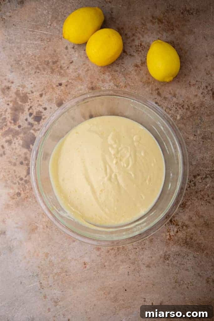 Smooth lemon bar filling mixture in a bowl