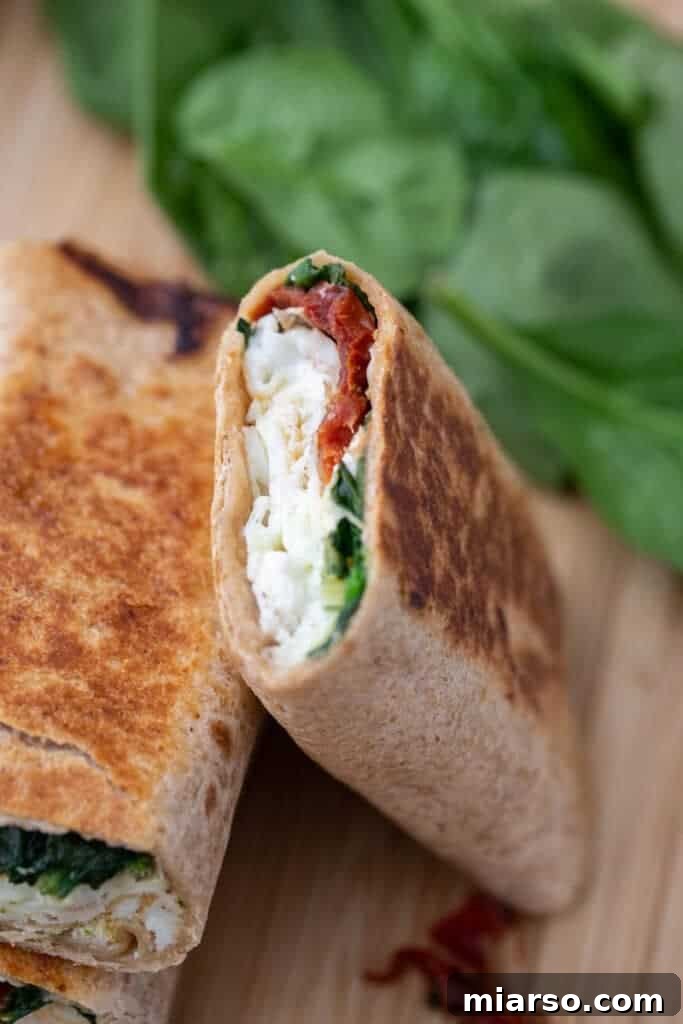 Starbucks egg white wrap sliced in half for serving