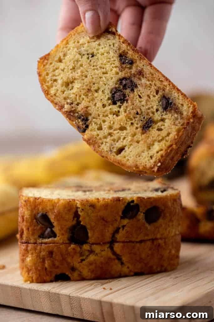 A stack of quick bread with visible chocolate chips, showcasing the delicious cake mix banana bread