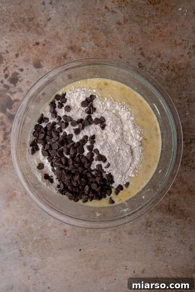 Mixing wet ingredients in a bowl for banana bread