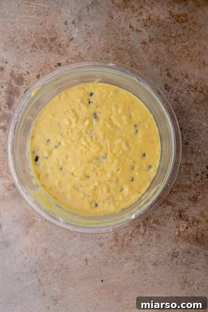 Banana bread batter in a mixing bowl before baking