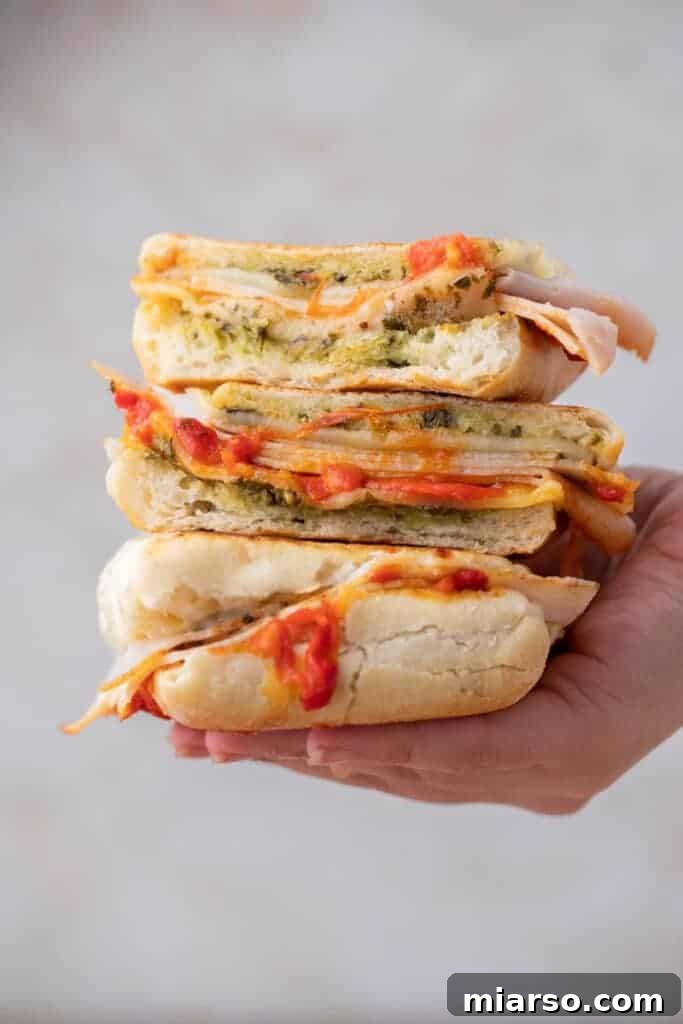 Stack of Starbucks turkey provolone panini, golden brown and delicious