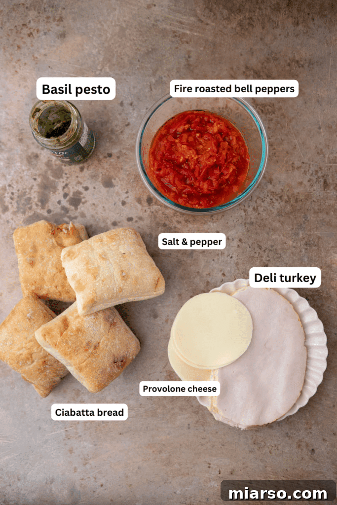 Ingredients on the counter for making turkey pesto panini