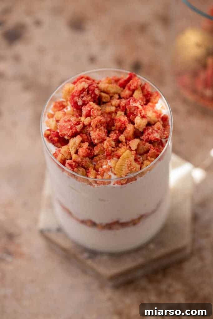 Heavenly Strawberry Shortcake McFlurry 11 Overhead shot of a beautifully layered homemade Strawberry Shortcake McFlurry in a clear glass.