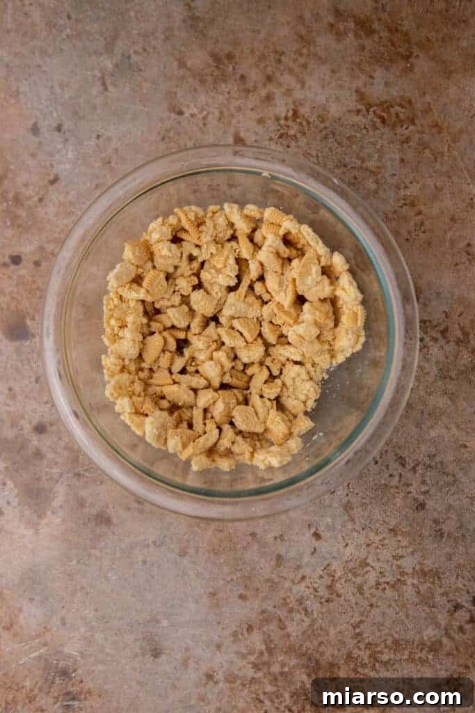 Heavenly Strawberry Shortcake McFlurry 4 Crushed golden Oreos in a bowl, ready for mixing to create the strawberry shortcake crunch.