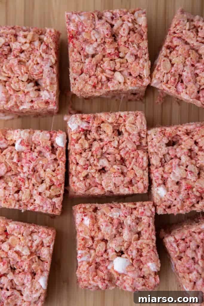 Finished strawberry rice krispies treats cooling in the pan.