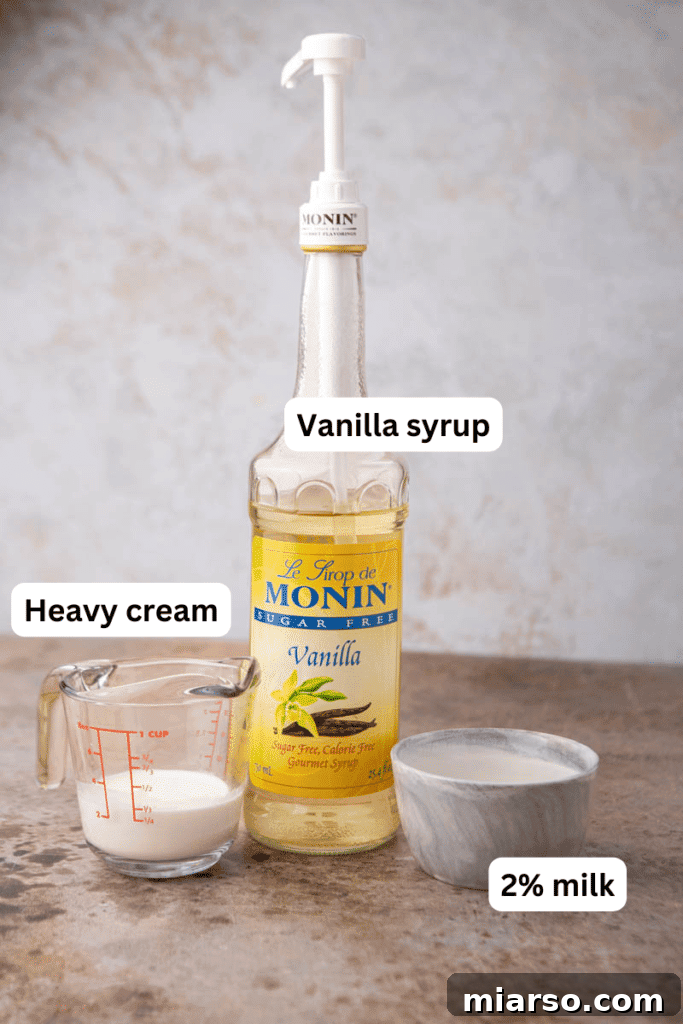 Ingredients for vanilla sweet cream cold foam laid out on a kitchen counter