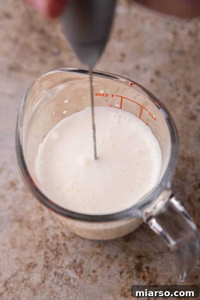 Vanilla sweet cold foam being frothed in a cup