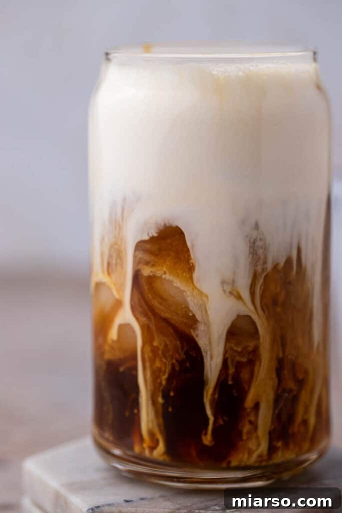 Close up of Starbucks vanilla sweet cream cold foam with coffee