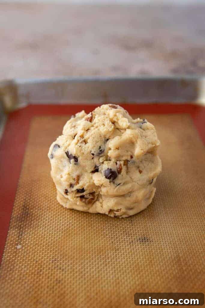 Cookie dough ball on baking sheet