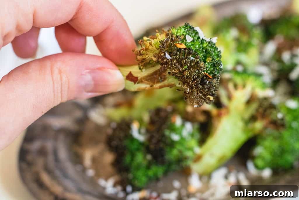 Close-up of freshly air-fried broccoli with parmesan, ready to eat