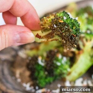 Air fryer broccoli with parmesan, garnished and ready to serve
