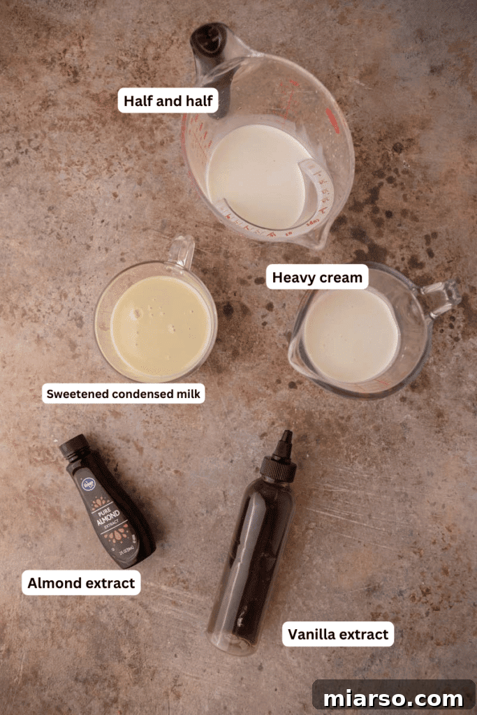 Various ingredients for the Italian sweet cream recipe laid out on a kitchen counter, including half and half, sweetened condensed milk, and extracts.