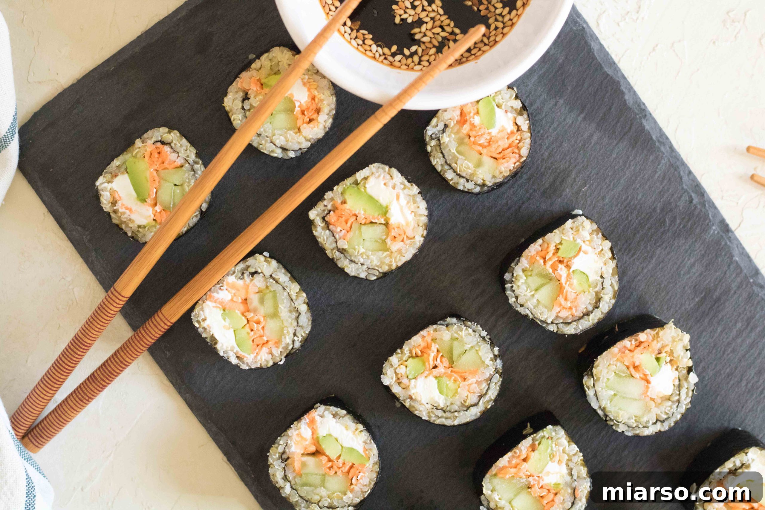 Final presentation of vegetable quinoa sushi rolls, expertly sliced and arranged.