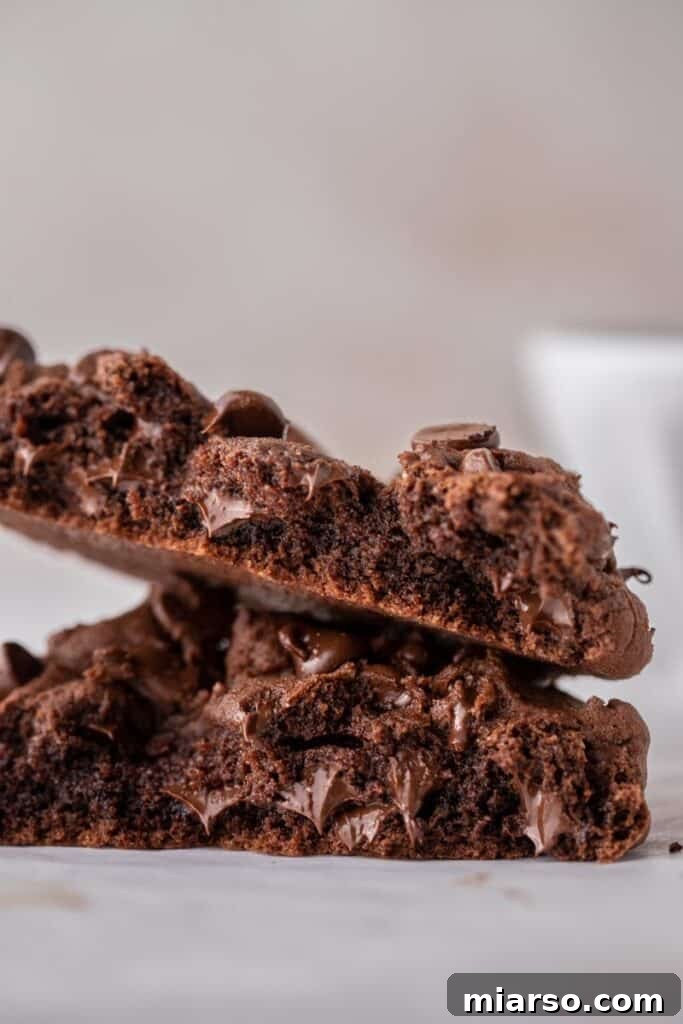 A perfectly baked single-serve double chocolate cookie on a cooling rack, ready to be enjoyed.