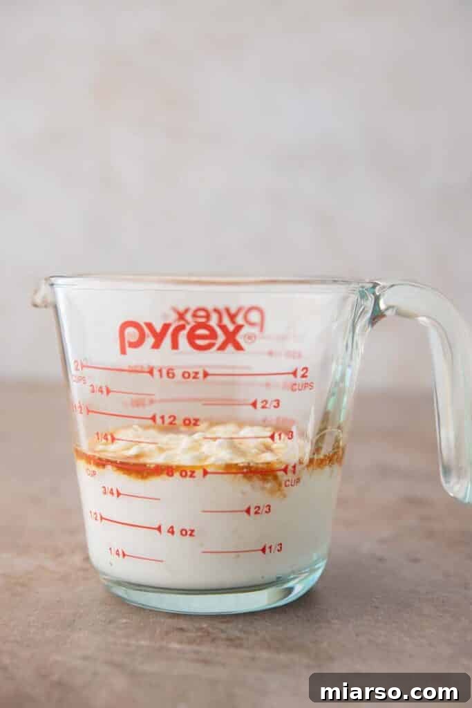 Blended wet ingredients in a cup for cottage cheese cookie dough.