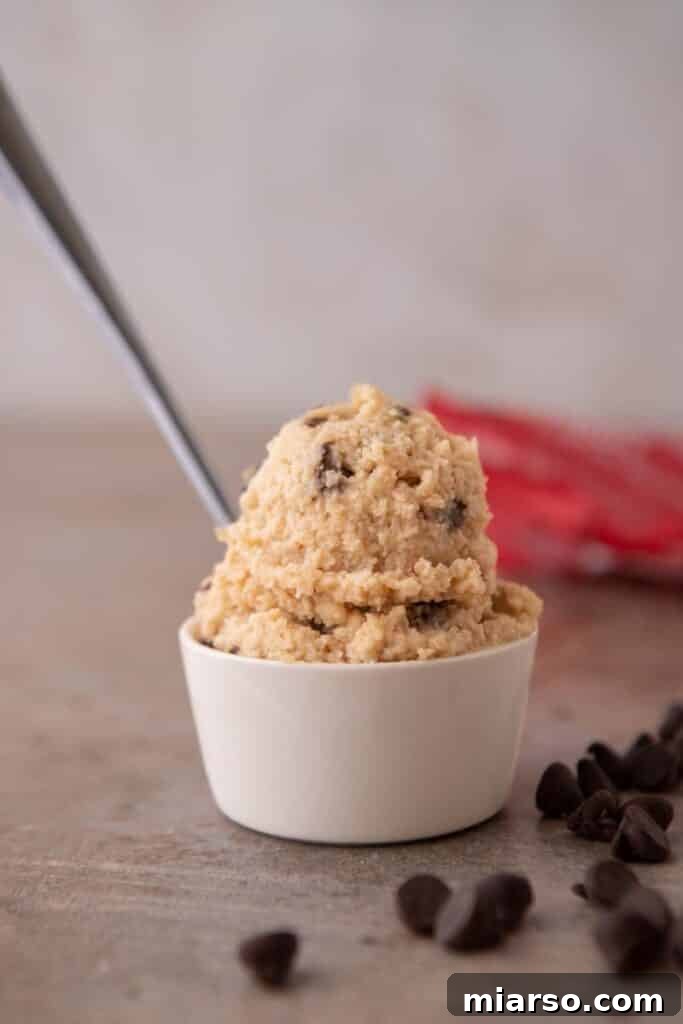 Cottage cheese chocolate chip cookie dough in a bowl with a spoon.
