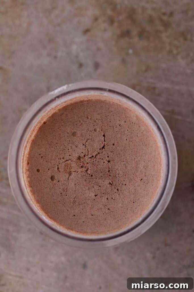 Decadent Ninja Creami Chocolate Ice Cream 6 Frozen Ninja Creami chocolate ice cream mixture