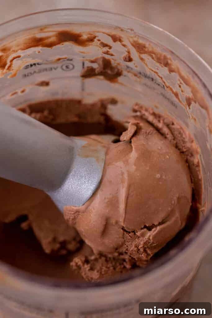 Decadent Ninja Creami Chocolate Ice Cream 8 Ninja Creami chocolate ice cream in pint cup after initial processing