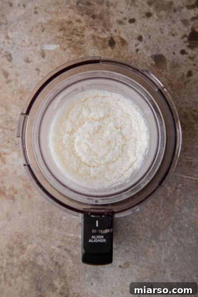 Frozen ice cream base in Ninja Creami pint container