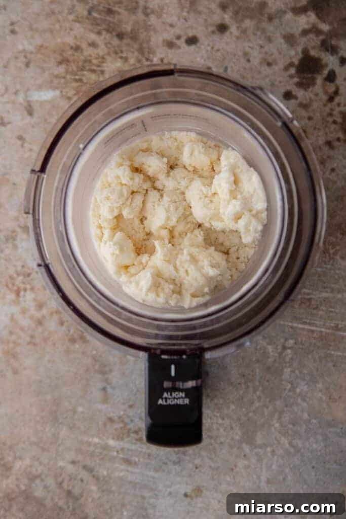 Soft serve vanilla ice cream coming out of Ninja Creami