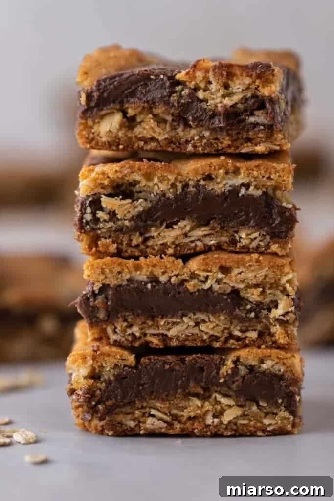 Decadent Starbucks Oat Fudge Bars 2 Stack of Starbucks oat fudge bars, showing the distinct layers of oatmeal cookie and dense chocolate fudge.