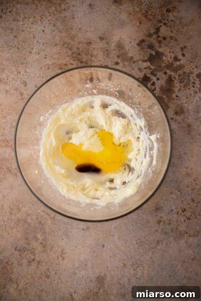 Wet ingredients for the cookie dough in a mixing bowl, creamy and well-combined.