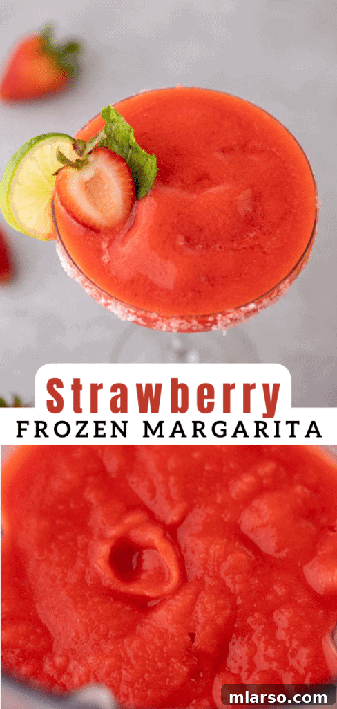 A frosty glass of frozen strawberry margarita with a blurred background, emphasizing its refreshing appeal.