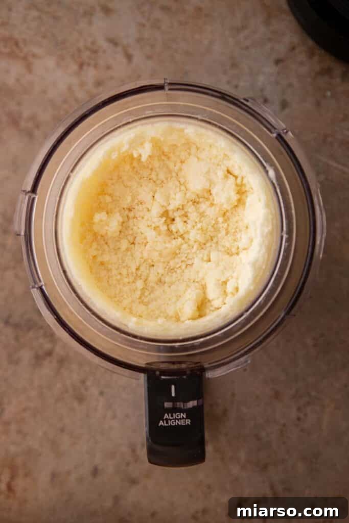 Ninja Creami pineapple sorbet after churning, showing a creamy texture.