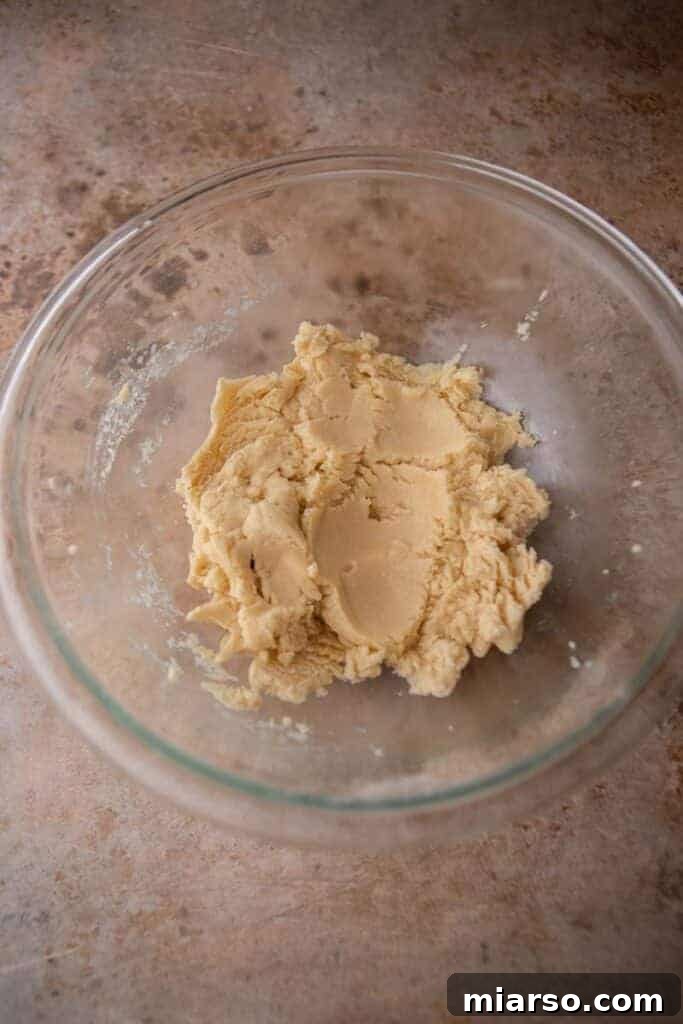 Cookie dough being mixed in a bowl