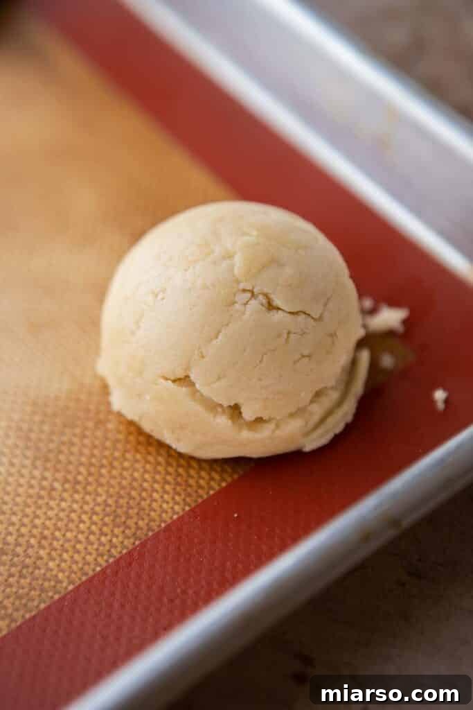 Cookie dough balls on a baking sheet