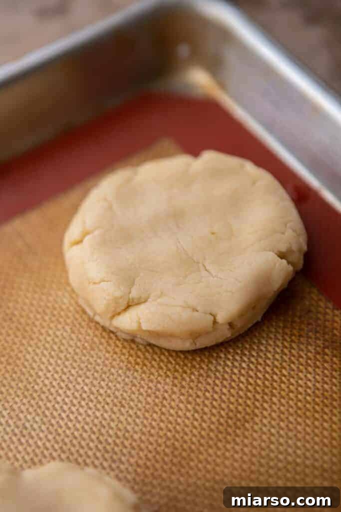 Flattened cookie dough on a baking sheet