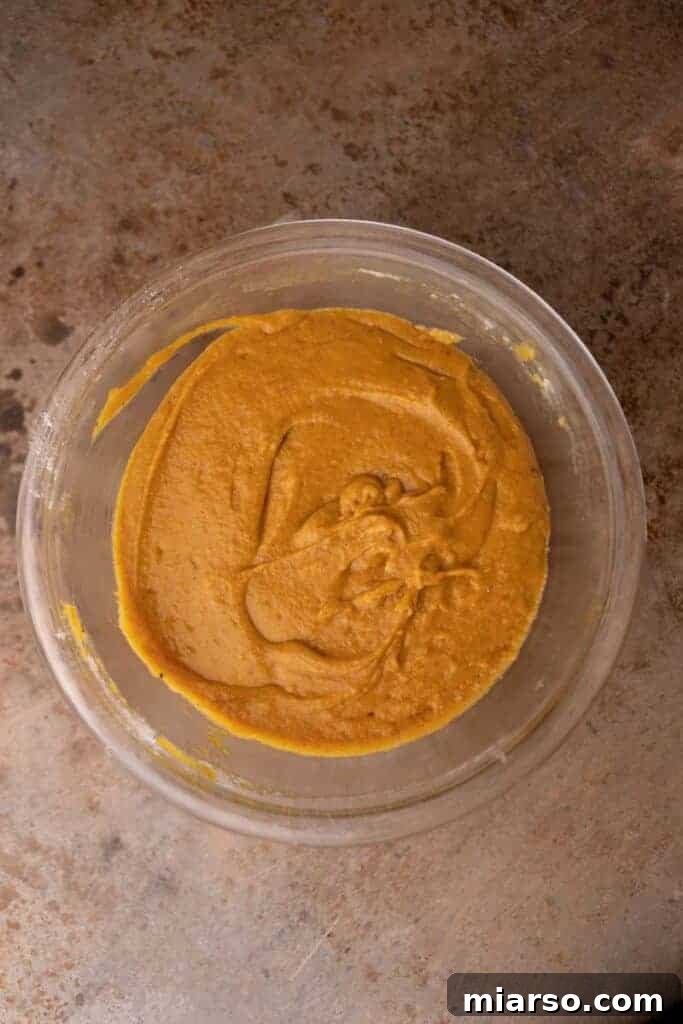 Pumpkin bread batter mixed and ready to be poured.