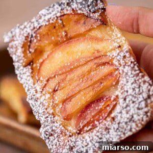 Hand holding upside down pastries