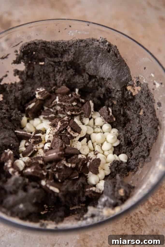 Crumbl's Chocolate Cookies & Cream Bliss 6 Cookie dough with dry ingredients just mixed in, before adding chocolate chips and Oreos.