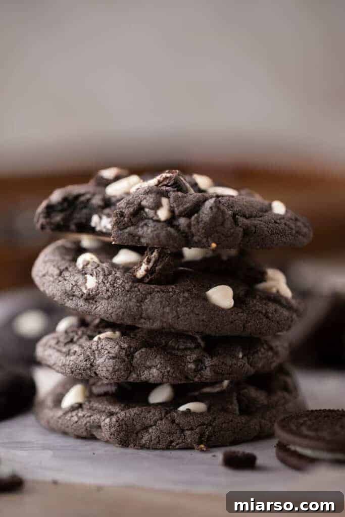 Crumbl's Chocolate Cookies & Cream Bliss 10 A beautifully arranged stack of Crumbl Chocolate Cookies and Cream Cookies, showcasing their delightful texture and toppings.