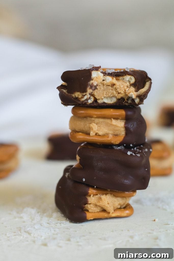 The best peanut butter buckeye pretzel bites, drizzled with chocolate.