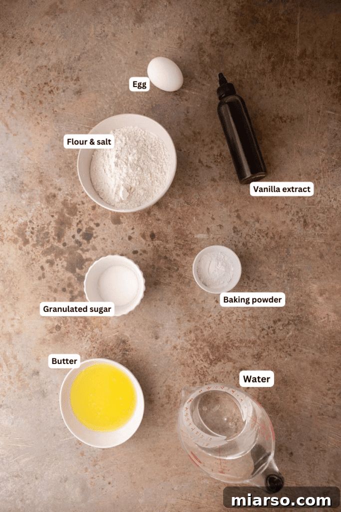 Fluffy Pancakes: No Milk, No Fuss 3 Ingredients laid out with labels for flour, egg, butter, sugar, water, and vanilla