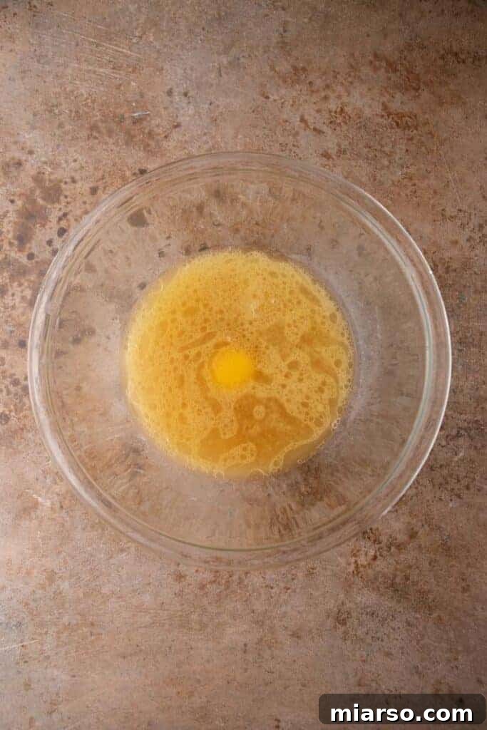 Fluffy Pancakes: No Milk, No Fuss 4 Bowl with egg, melted butter, water, and vanilla mixed for batter