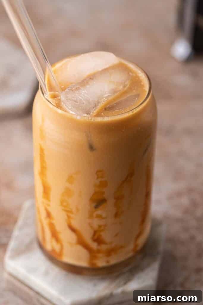 Quick 5-Minute Iced Caramel Coffee Perfection 2 Delicious iced caramel coffee prepared in a tall glass, ready to be enjoyed.