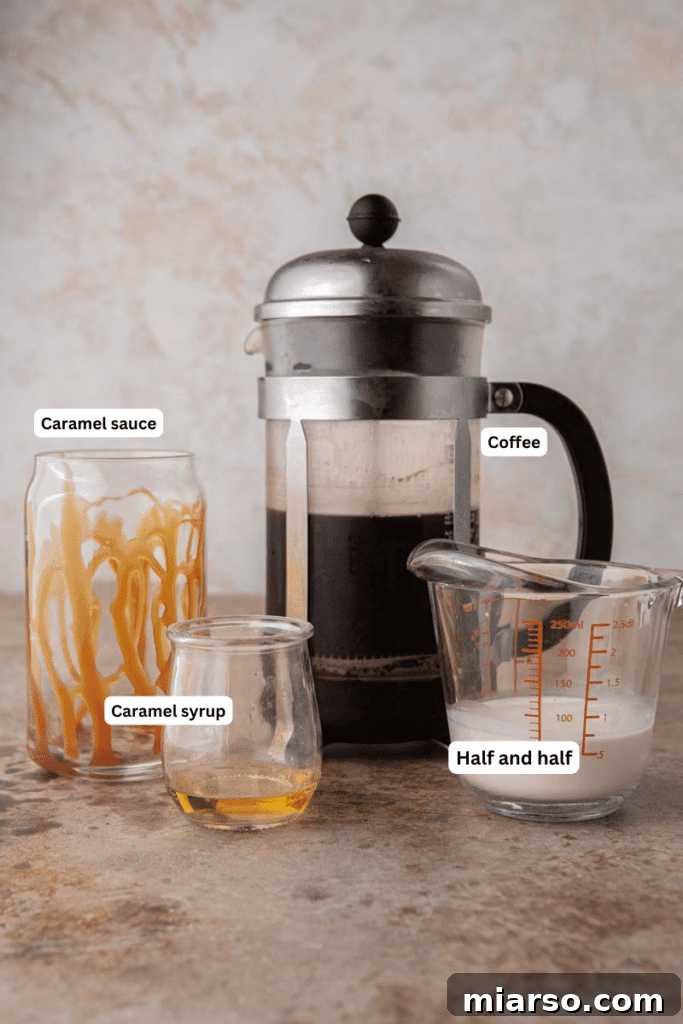 Quick 5-Minute Iced Caramel Coffee Perfection 3 Ingredients for making iced caramel coffee laid out on a kitchen counter, including coffee, caramel syrup, and creamer.