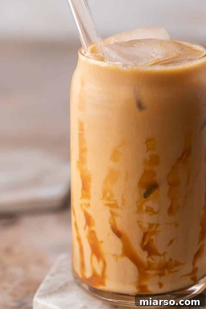 Quick 5-Minute Iced Caramel Coffee Perfection 8 Close-up of a perfectly prepared iced caramel coffee with caramel drizzle, ready to drink.