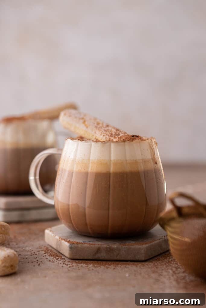 Mastering the Dreamy Tiramisu Latte Recipe 2 A beautiful cup of homemade Tiramisu Latte, garnished with cocoa powder.