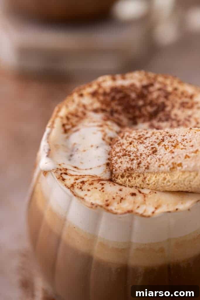 Mastering the Dreamy Tiramisu Latte Recipe 4 Close-up of the rich mascarpone foam topping a Tiramisu Latte.