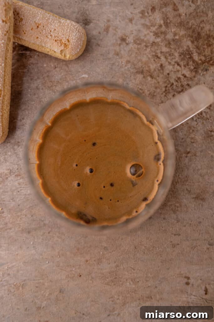 Mastering the Dreamy Tiramisu Latte Recipe 5 Freshly brewed espresso in a clear coffee cup.