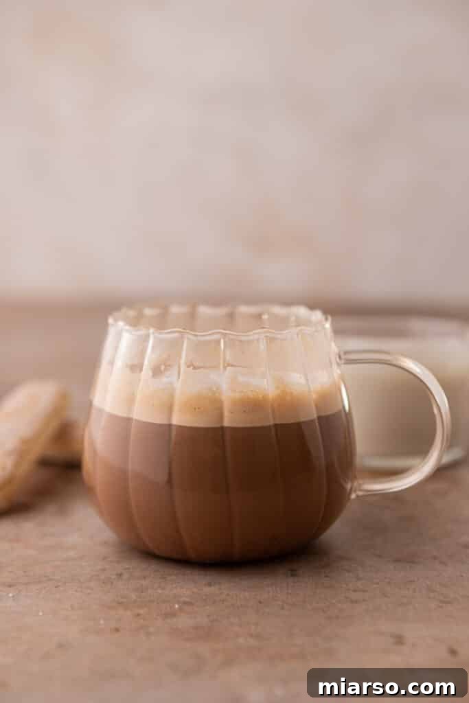 Mastering the Dreamy Tiramisu Latte Recipe 6 Espresso with steamed milk in a cup, ready for topping.